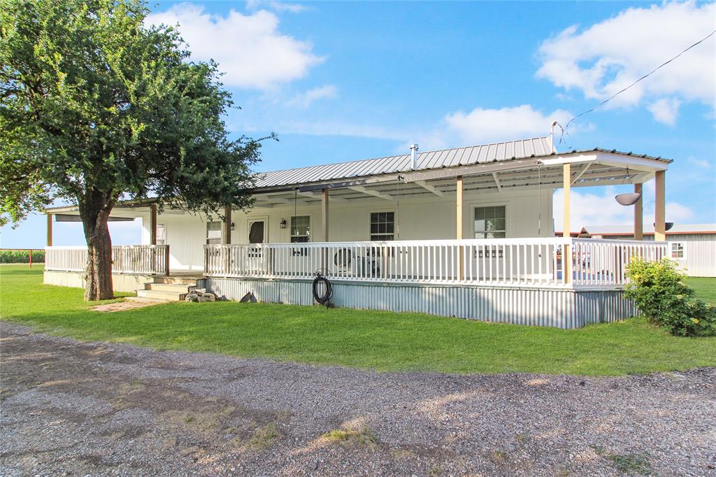 455 Hughes Cemetery Road Italy, TX 76651 - Photo 23 of 40 a view of a house with a yard and sitting area