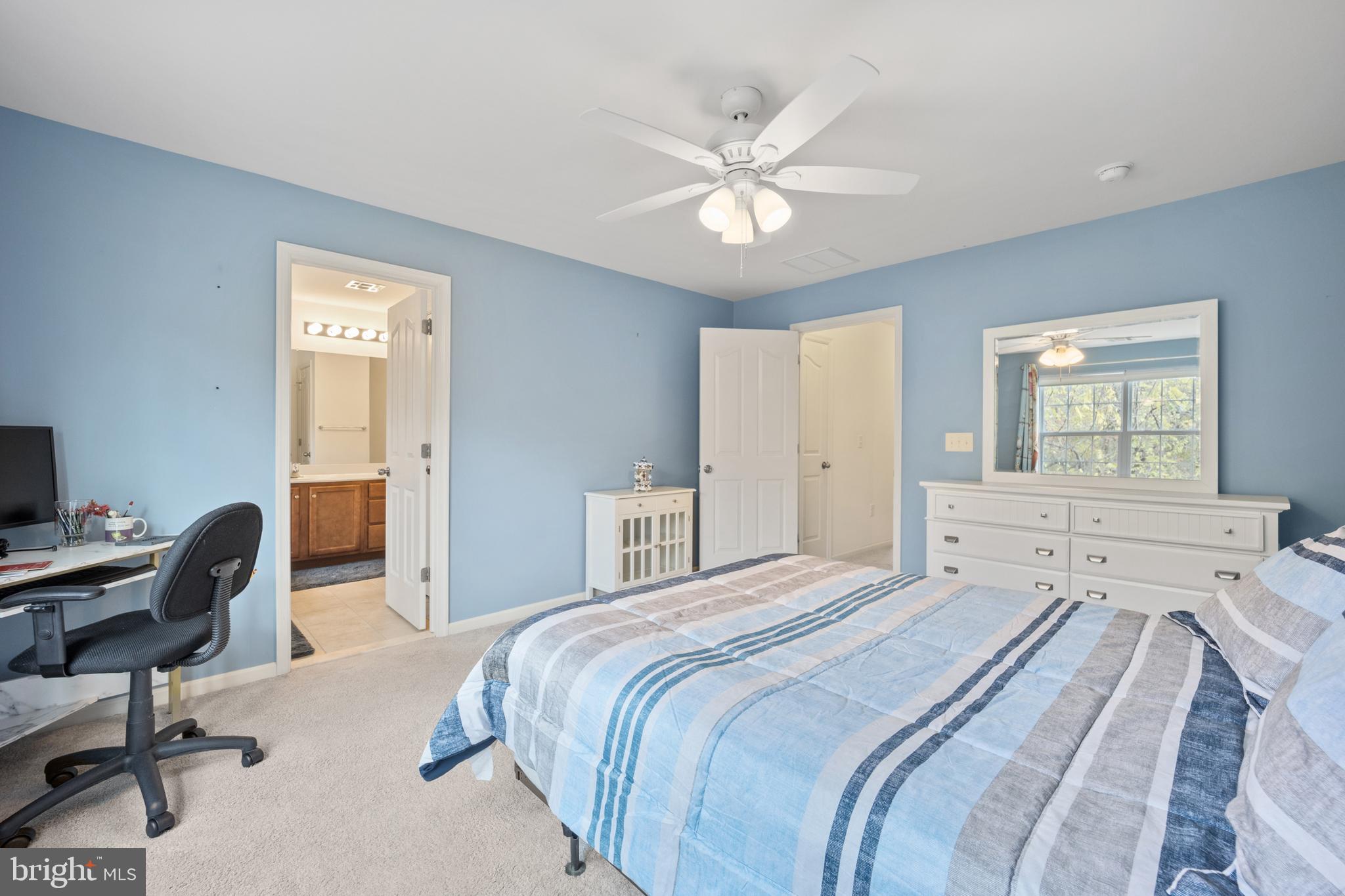 151 Creekside Way Burlington, NJ 08016 - Photo 18 of 35 a bedroom with a bed and a chandelier