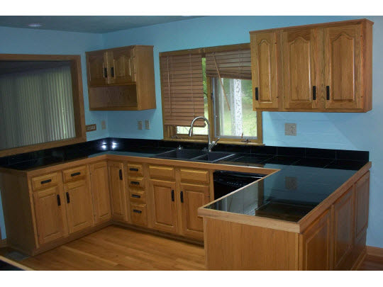 2990 Reid Farm Road Rockford, IL 61114 - Photo 2 of 11 a kitchen that has a sink and a stove