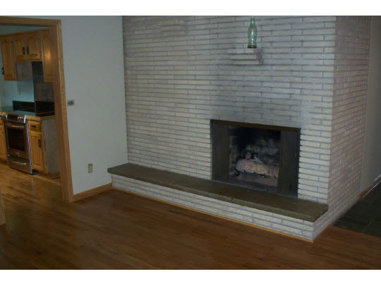 2990 Reid Farm Road Rockford, IL 61114 - Photo 3 of 11 a living room with a fireplace