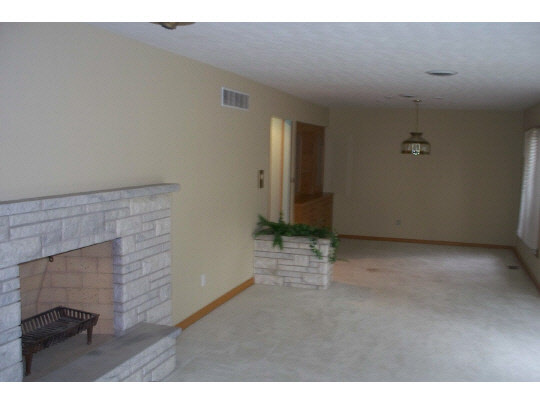 2990 Reid Farm Road Rockford, IL 61114 - Photo 4 of 11 a view of an empty room and wooden floor