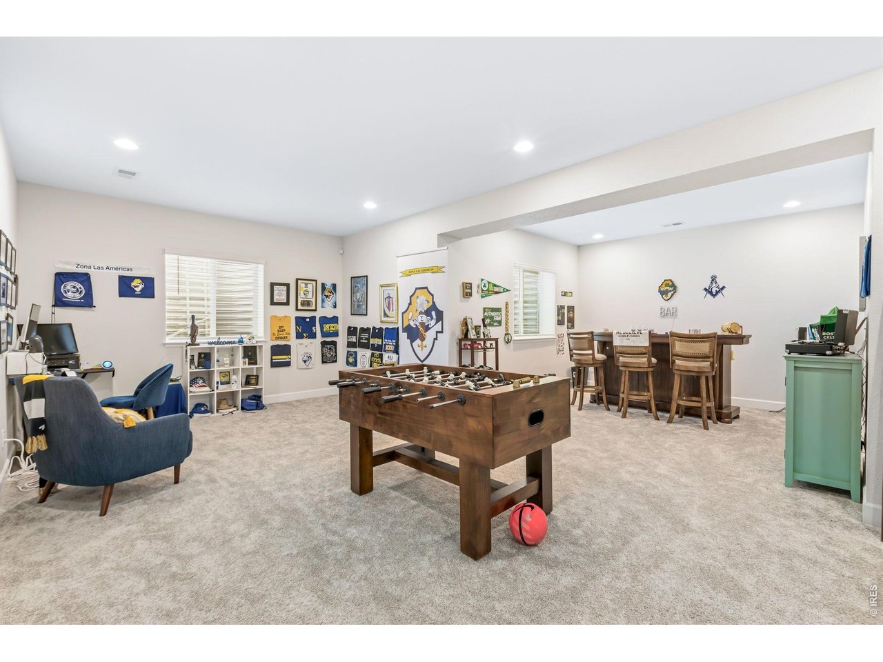 955 Rustling Street Windsor, CO 80550 - Photo 25 of 34 a living room with furniture and a dining table with kitchen view