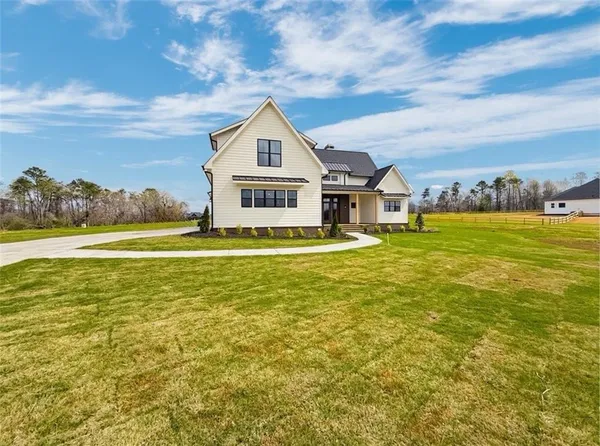 a front view of a house with a yard