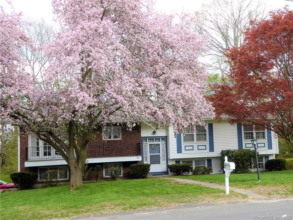 Large 10 room home with 5 possible bedrooms and a second kitchen in the finished lower level for summer cooking.