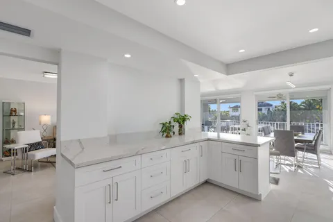 a kitchen with sink and cabinets