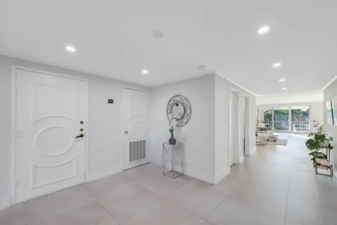 a view of a livingroom with furniture hardwood floor and a ceiling fan