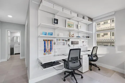 a workspace with furniture and window