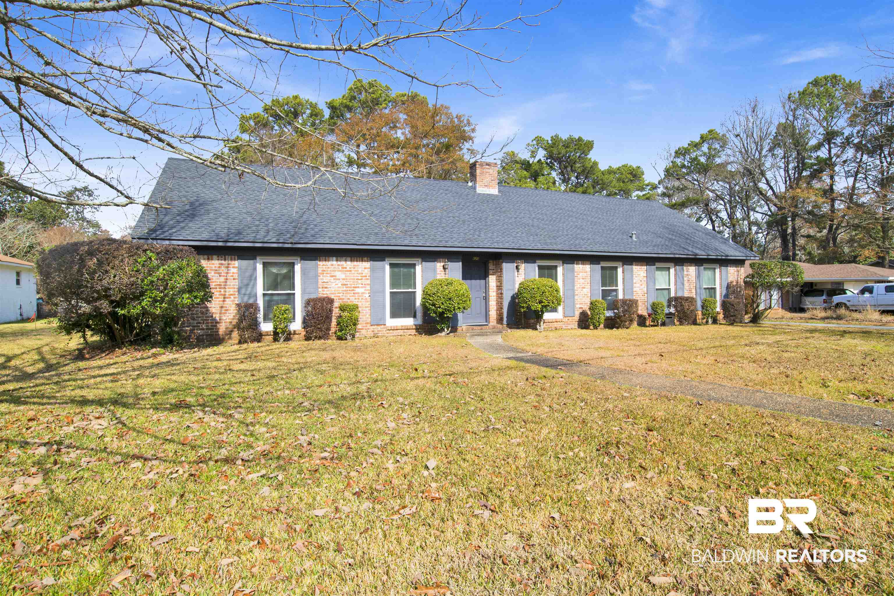 620 Spanish Main Spanish Fort, AL 36527 - Photo 31 of 31 Ranch-style house with roof with shingles, a chimney, and a front lawn