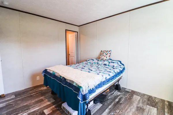 a bedroom with a bed and a closet