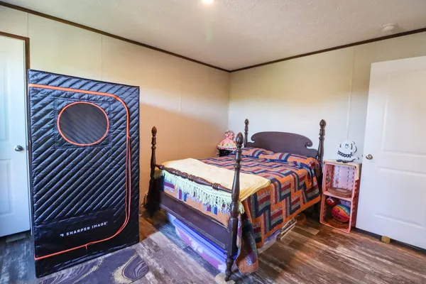 a bathroom with a granite countertop toilet sink and mirror