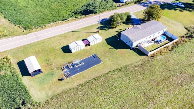an aerial view of residential houses with outdoor space