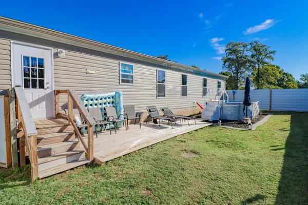 a view of a back yard of the house