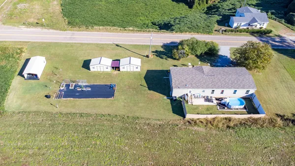 a view of a pool with a yard