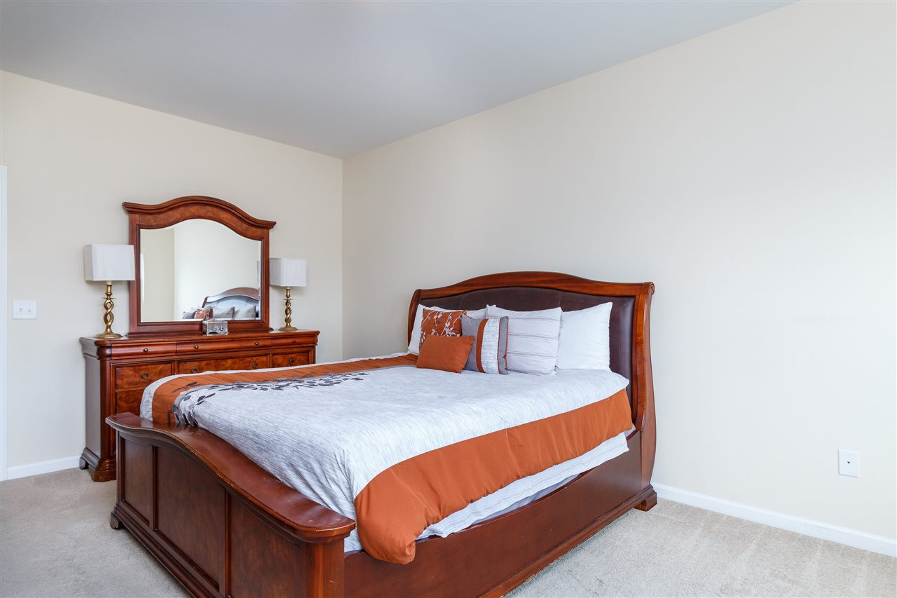 1305 Rodessa Run Raleigh, NC 27607 - Photo 17 of 25 Spacious master suite with beautiful natural light, connecting master bath, and walk in closet with wooden shelving. Master Bedroom