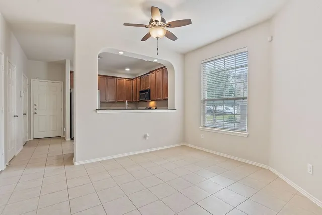 a view of a kitchen with a dishwasher cabinets and a window