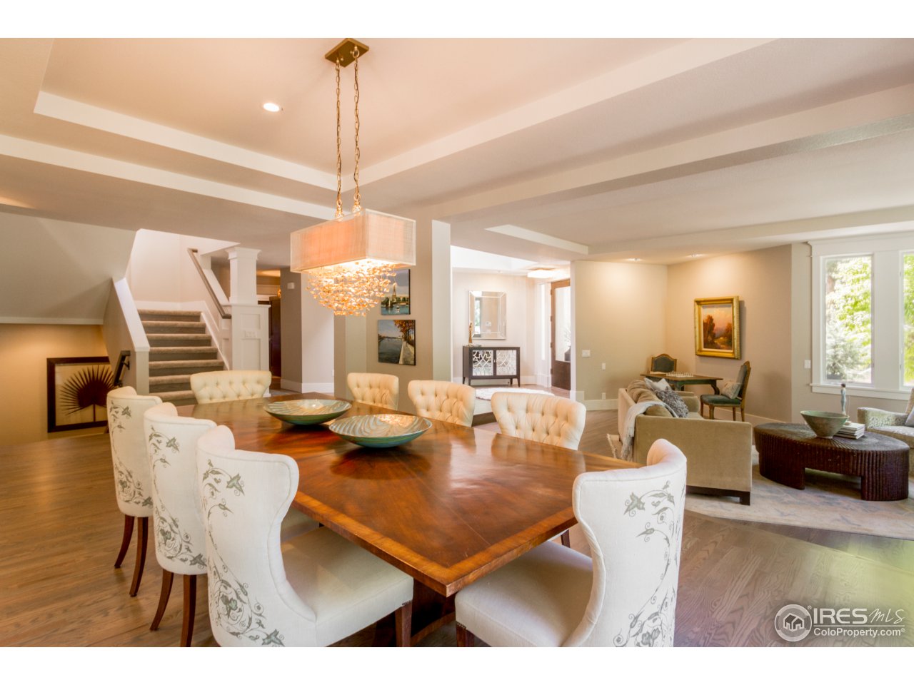 3551 4th Street Boulder, CO 80304 - Photo 16 of 38 a living room with furniture a rug and a chandelier