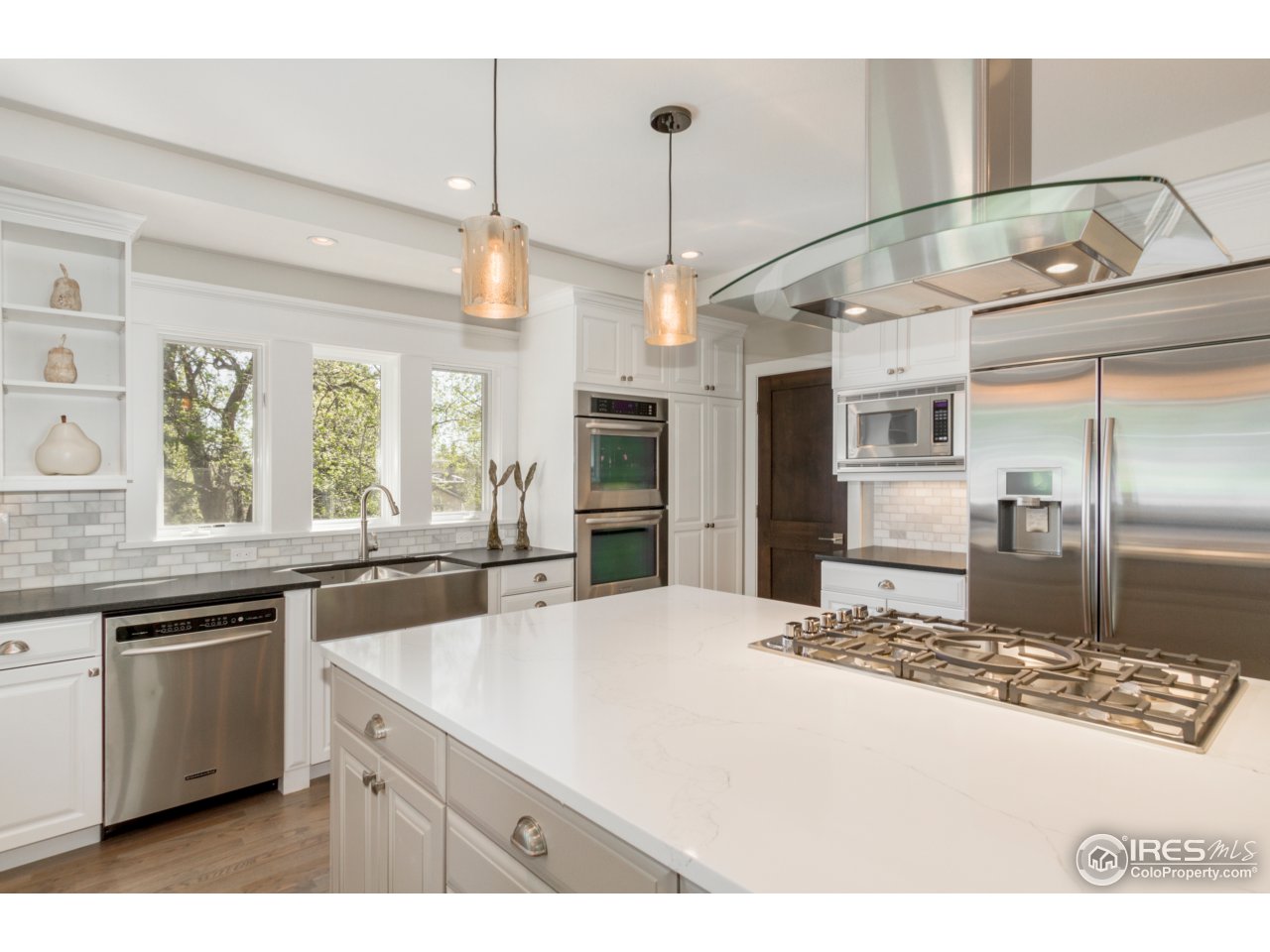 3551 4th Street Boulder, CO 80304 - Photo 8 of 38 a kitchen with kitchen island a sink stainless steel appliances and window