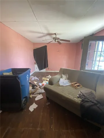 a bedroom with a bed and a mirror