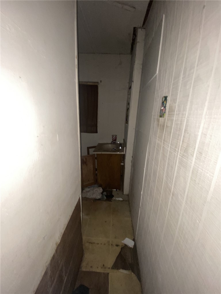 629 Southwest 7th Street Premont, TX 78375 - Photo 8 of 12 a bathroom with a sink and a toilet