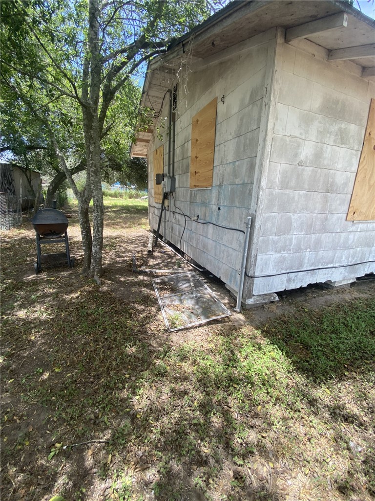 629 Southwest 7th Street Premont, TX 78375 - Photo 10 of 12 a view of a backyard with pathway
