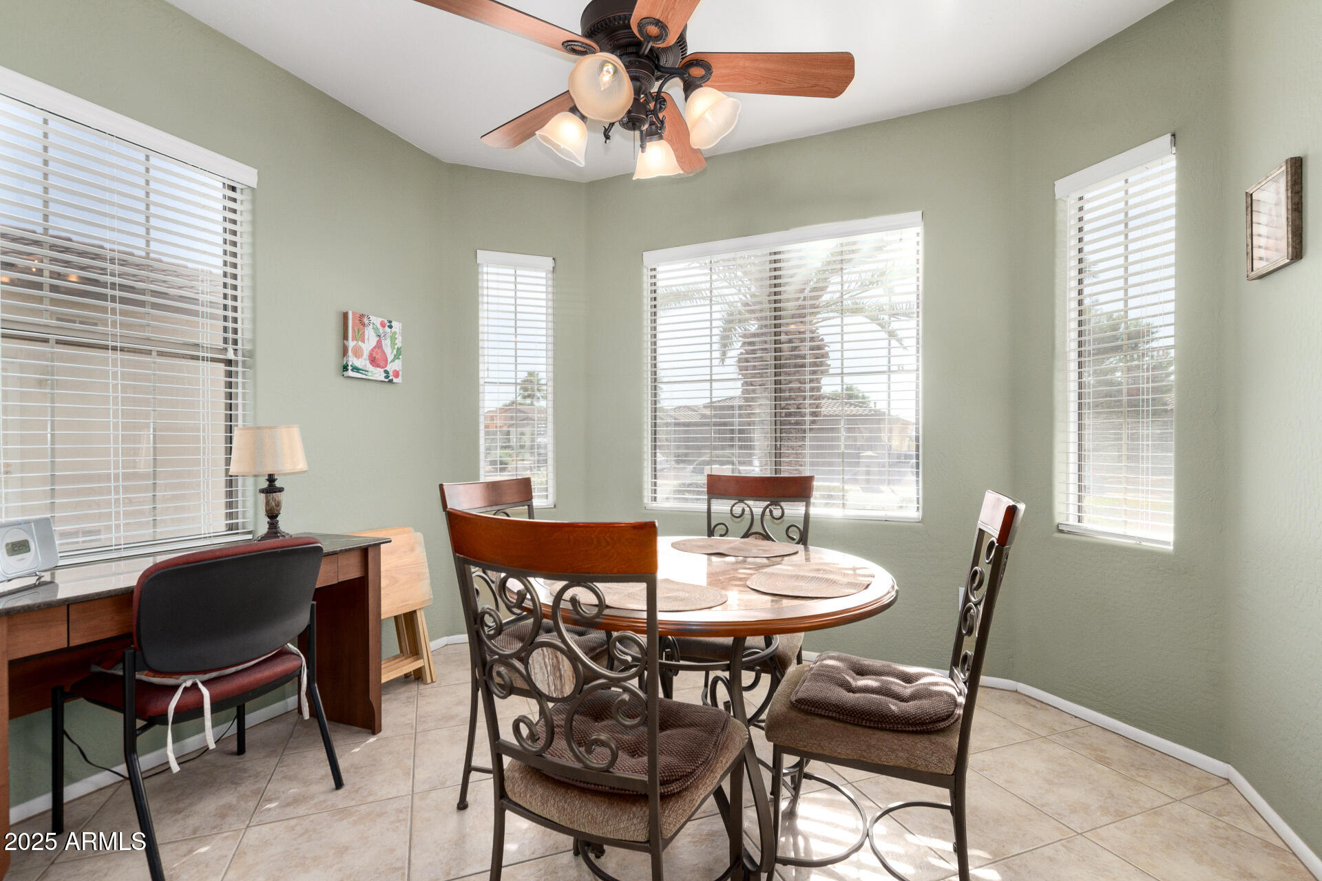 15448 West Moonlight Way Surprise, AZ 85374 - Photo 13 of 26 a dining room with furniture a chandelier and a large window