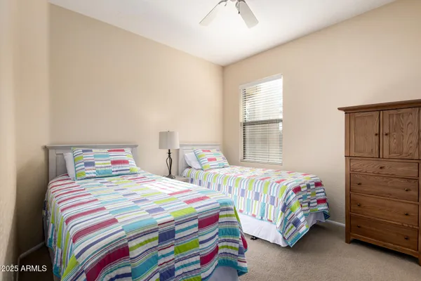 a bedroom with a bed and a table