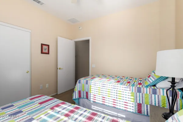 a bathroom with a sink a toilet a mirror and shower curtain