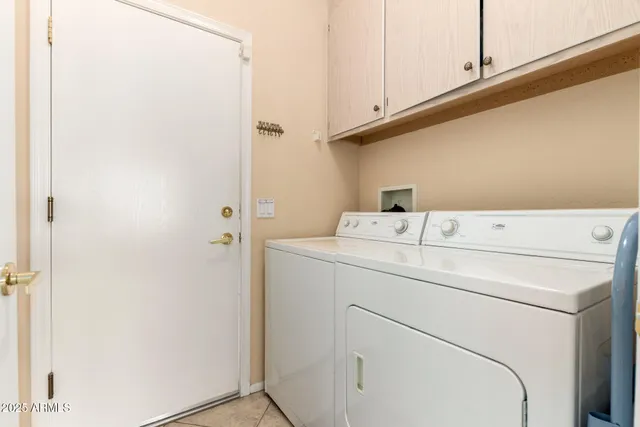 a view of a chairs and table in the balcony