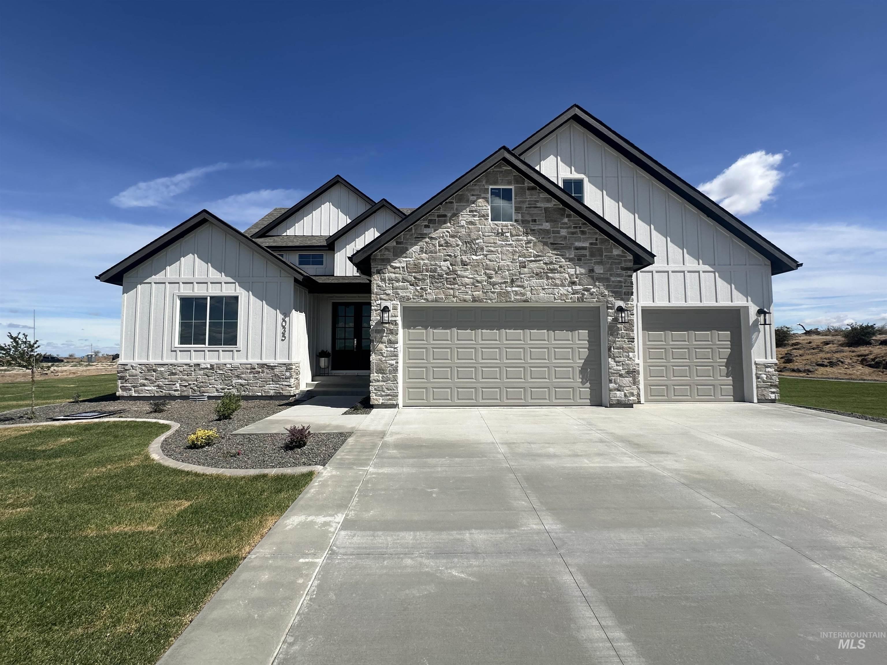 3035 Lake View Twin Falls, ID 83301 - Photo 1 of 41 Modern farmhouse exterior featuring board and batten siding, stone accents, and a dark asphalt shingle roof