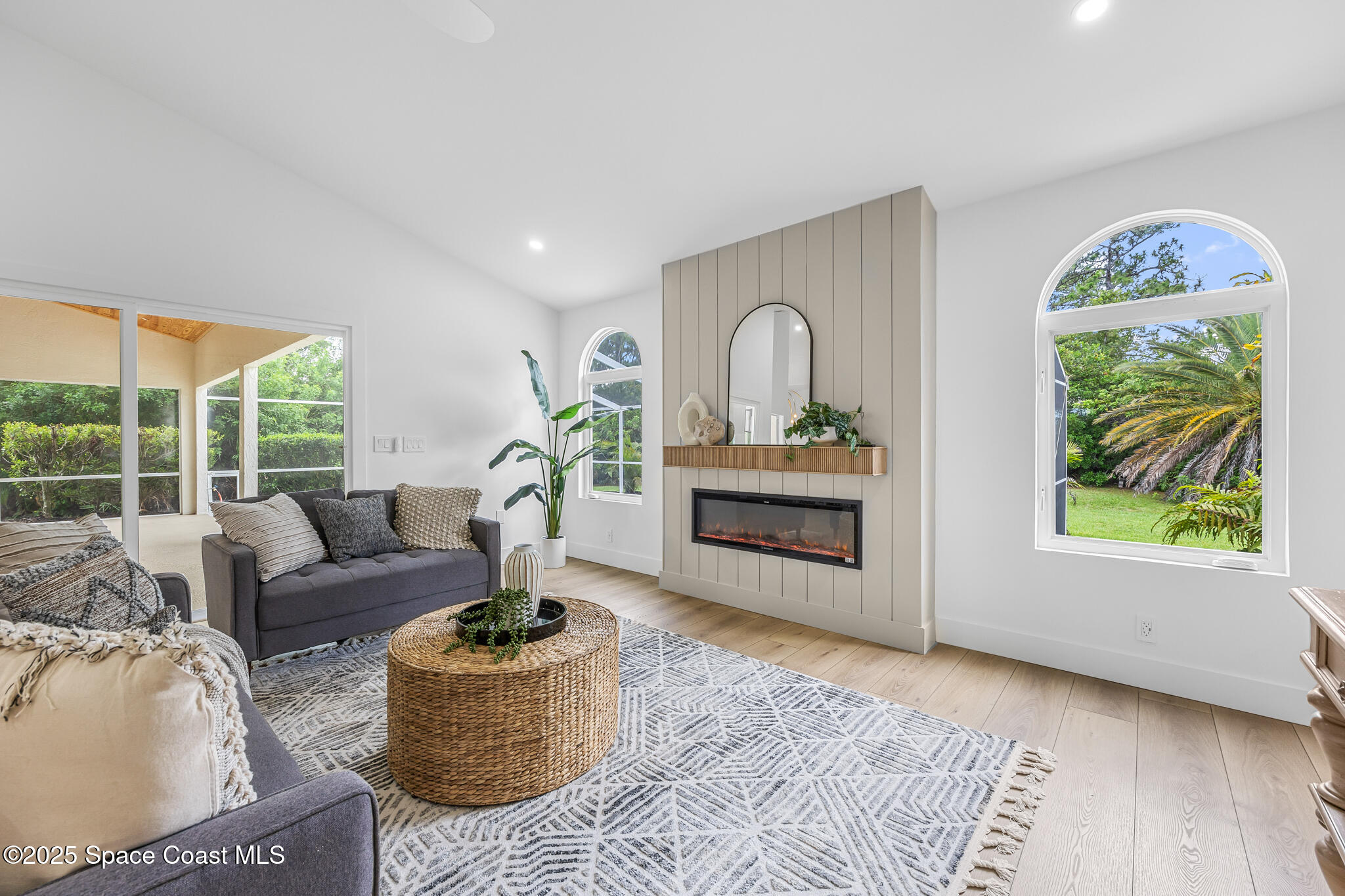 4340 Windover Way Melbourne, FL 32934 - Photo 12 of 42 a living room with furniture and a large window
