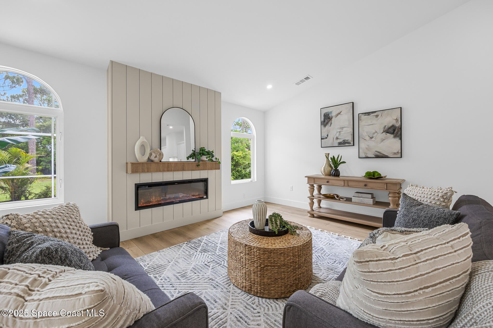 4340 Windover Way Melbourne, FL 32934 - Photo 14 of 42 a living room with furniture and a fireplace