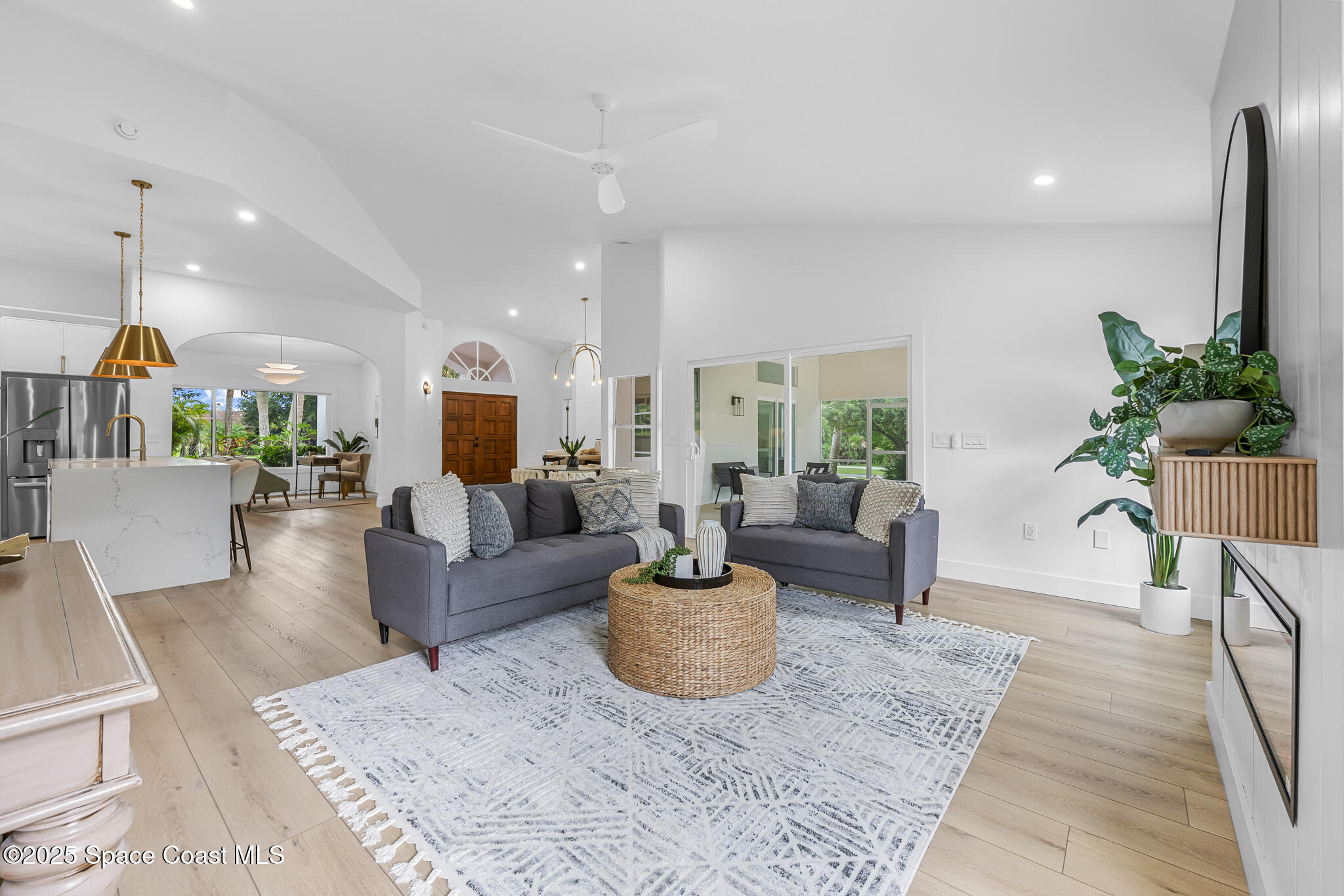 4340 Windover Way Melbourne, FL 32934 - Photo 15 of 42 a living room with furniture and a potted plant