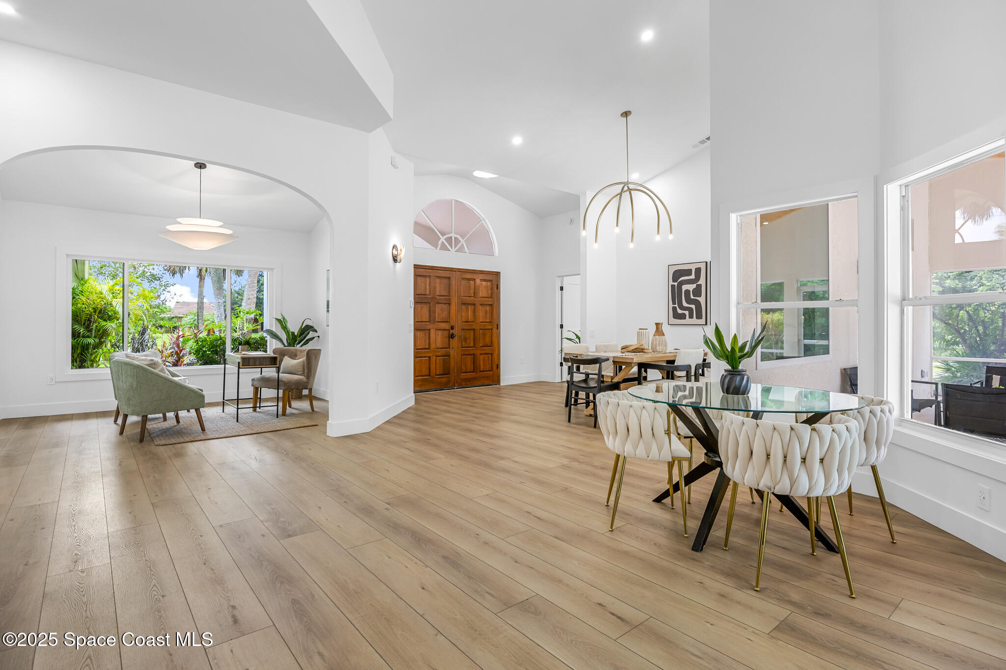 4340 Windover Way Melbourne, FL 32934 - Photo 16 of 42 a view of a dining room with furniture window and wooden floor