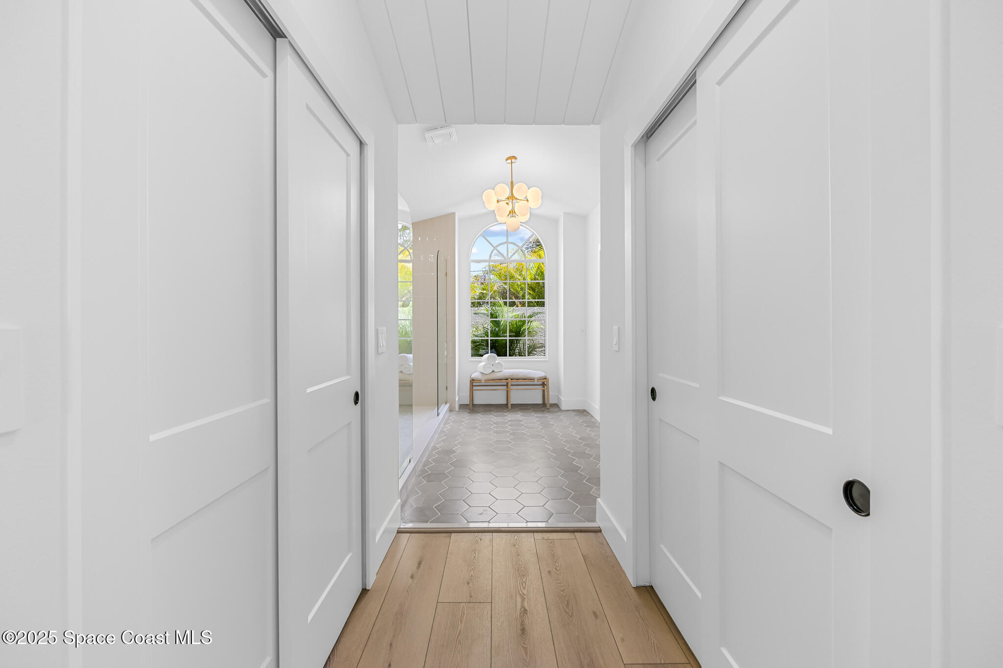 4340 Windover Way Melbourne, FL 32934 - Photo 26 of 42 a view of a hallway view with wooden floor and staircase