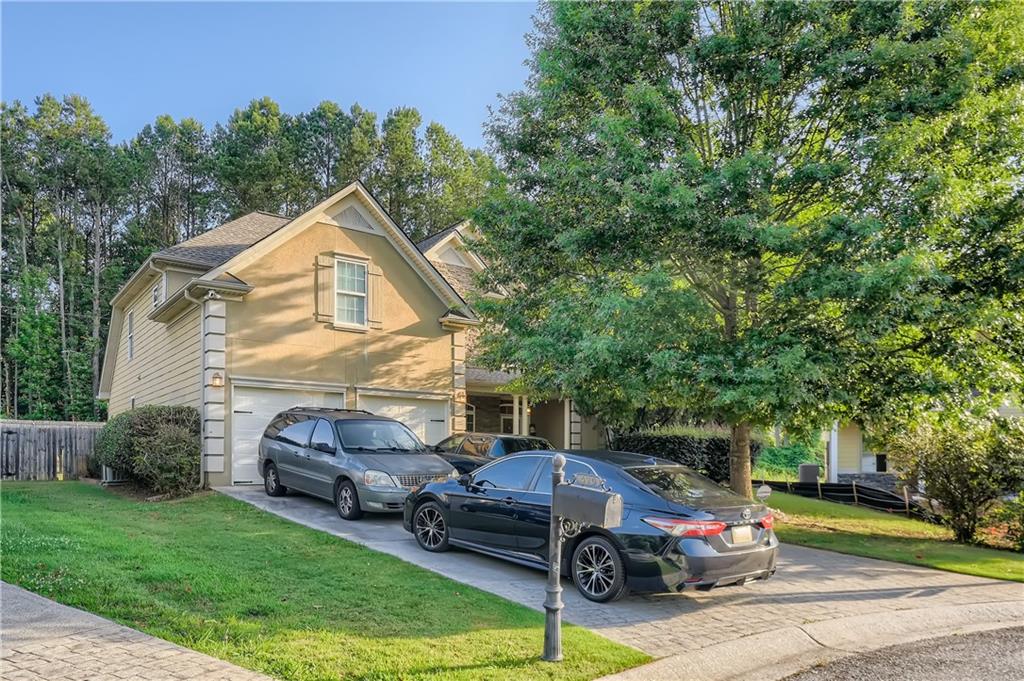 429 Flowery Branch Court Villa Rica, GA 30180 - Photo 1 of 1 a front view of a house with garden