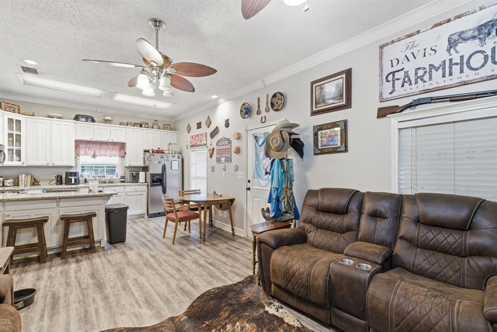 302 Tower Road Rio Vista, TX 76093 - Photo 18 of 29 Open-concept living space featuring wood-finish flooring throughout