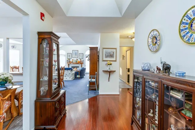 a very nice looking living room with wooden floor and furniture