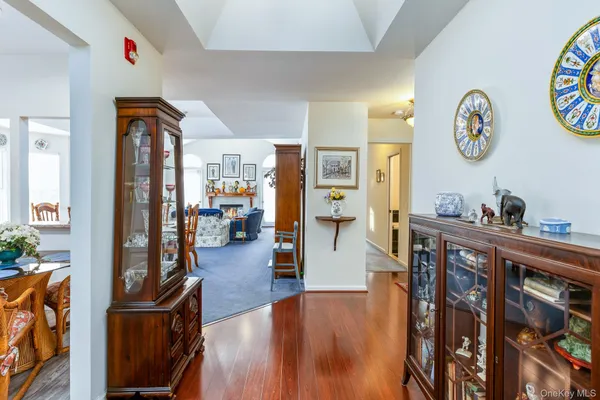 a very nice looking living room with wooden floor and furniture