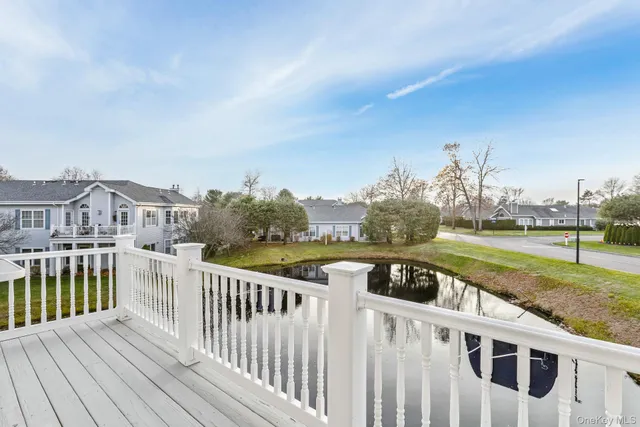 a view of a house with backyard and deck