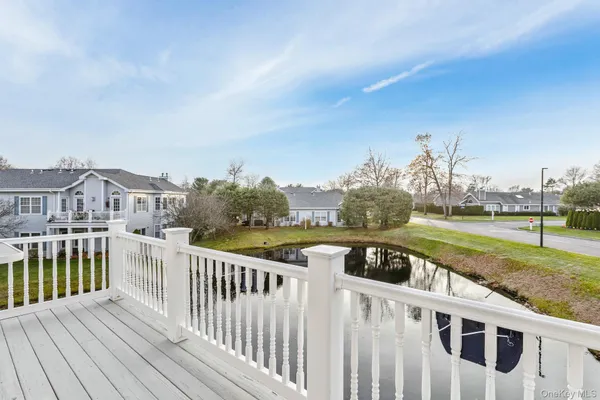 a view of a house with backyard and deck