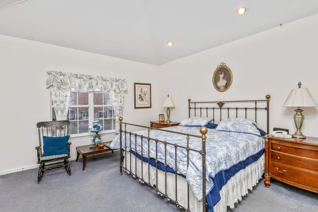 a bedroom with a bed and a table