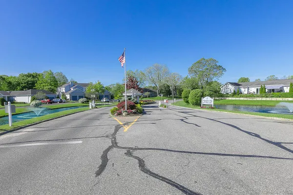 an aerial view of a house with a lake view