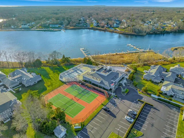 an aerial view of a house with a lake view