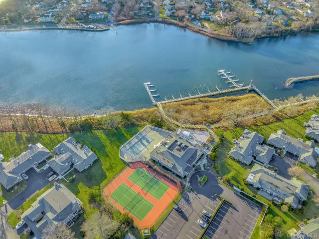 an aerial view of a house with a lake view