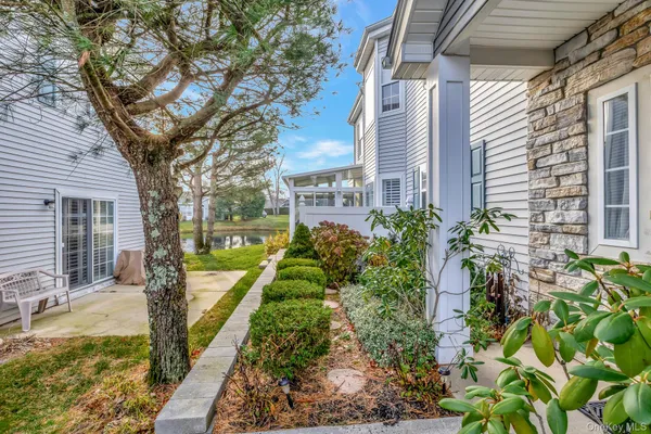 a view of a garden with a house