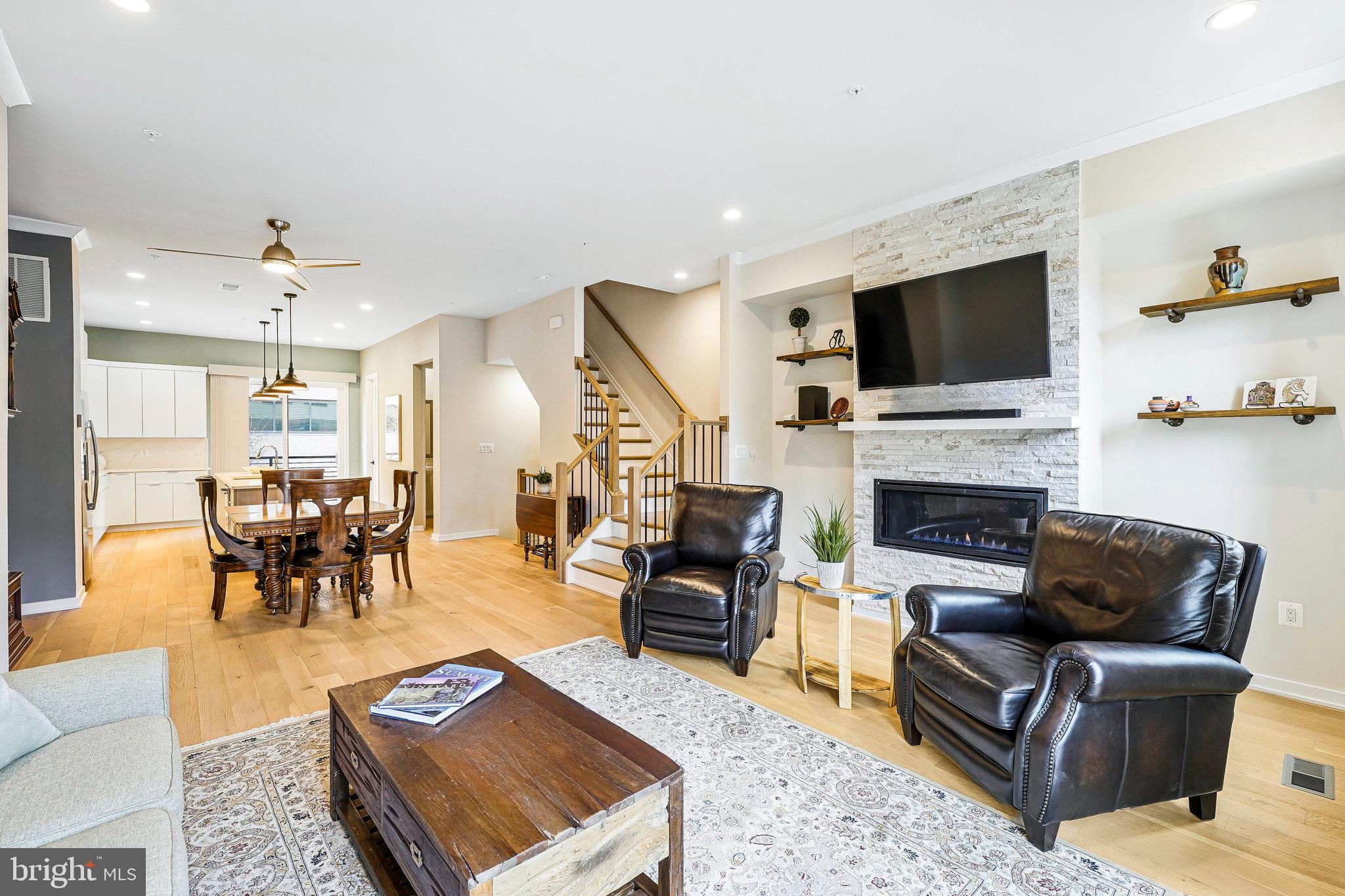11716 Paysons Way Reston, VA 20191 - Photo 16 of 34 a living room with furniture fireplace and a flat screen tv