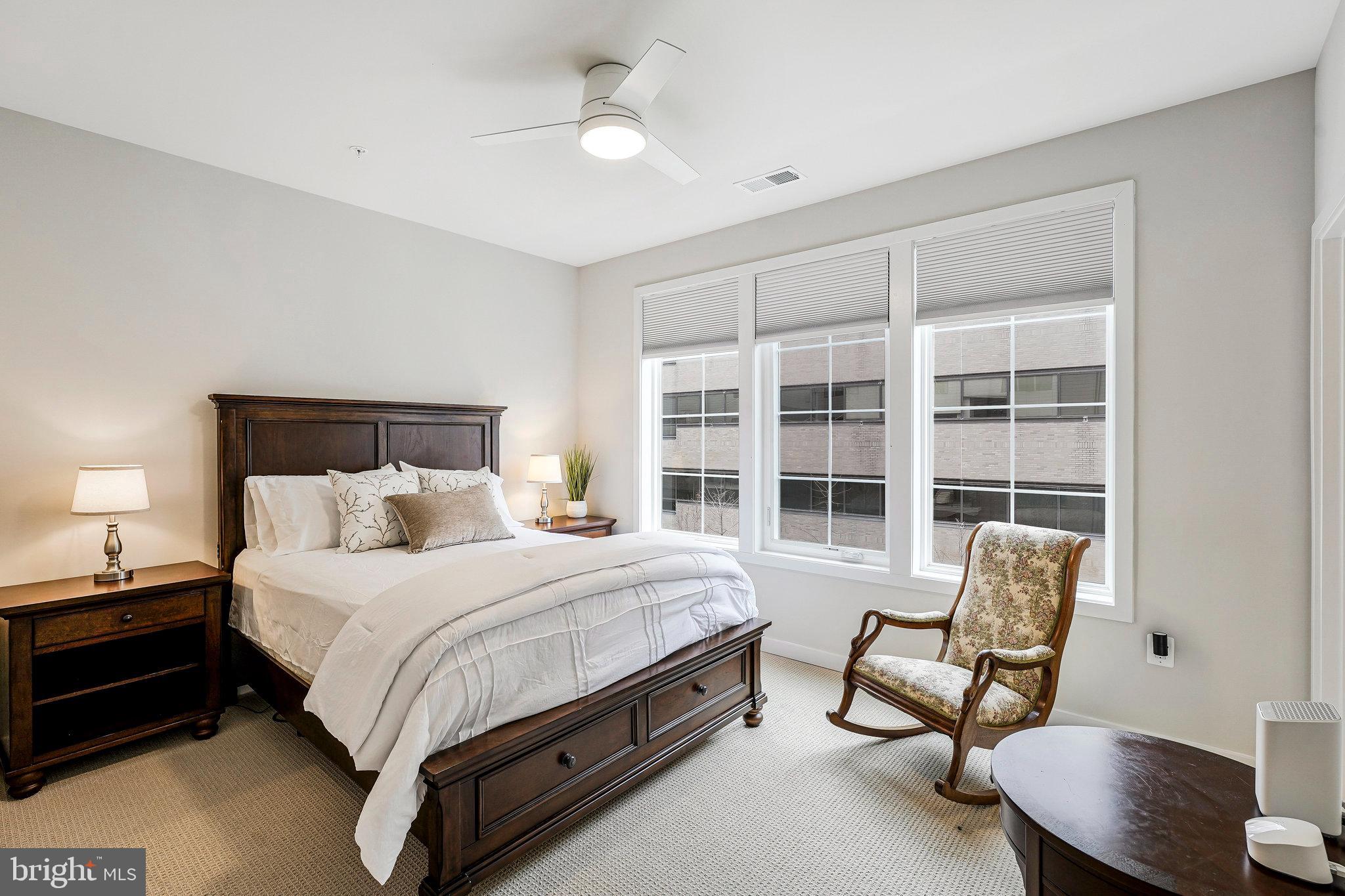 11716 Paysons Way Reston, VA 20191 - Photo 20 of 34 a bedroom with a bed chair and a window