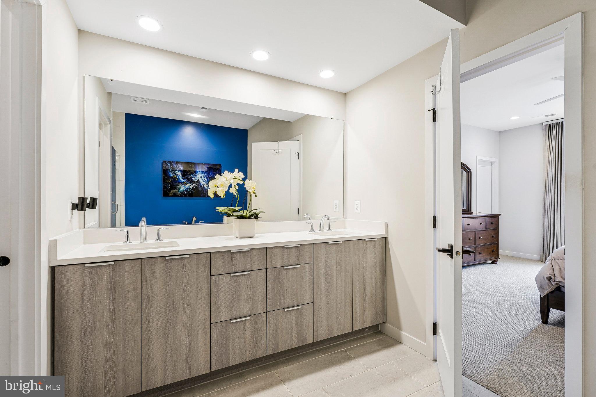 11716 Paysons Way Reston, VA 20191 - Photo 23 of 34 a spacious bathroom with a double vanity sink mirror and