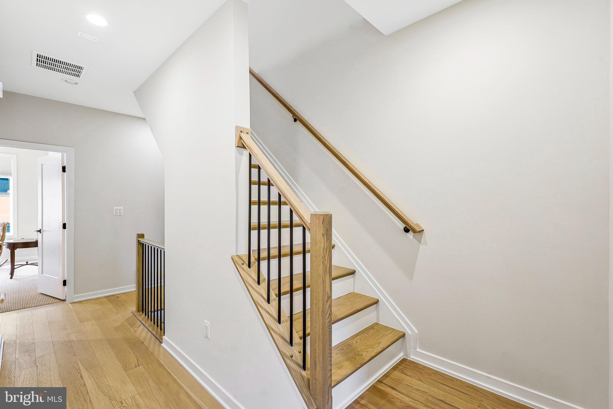11716 Paysons Way Reston, VA 20191 - Photo 25 of 34 a view of a hallway with staircase