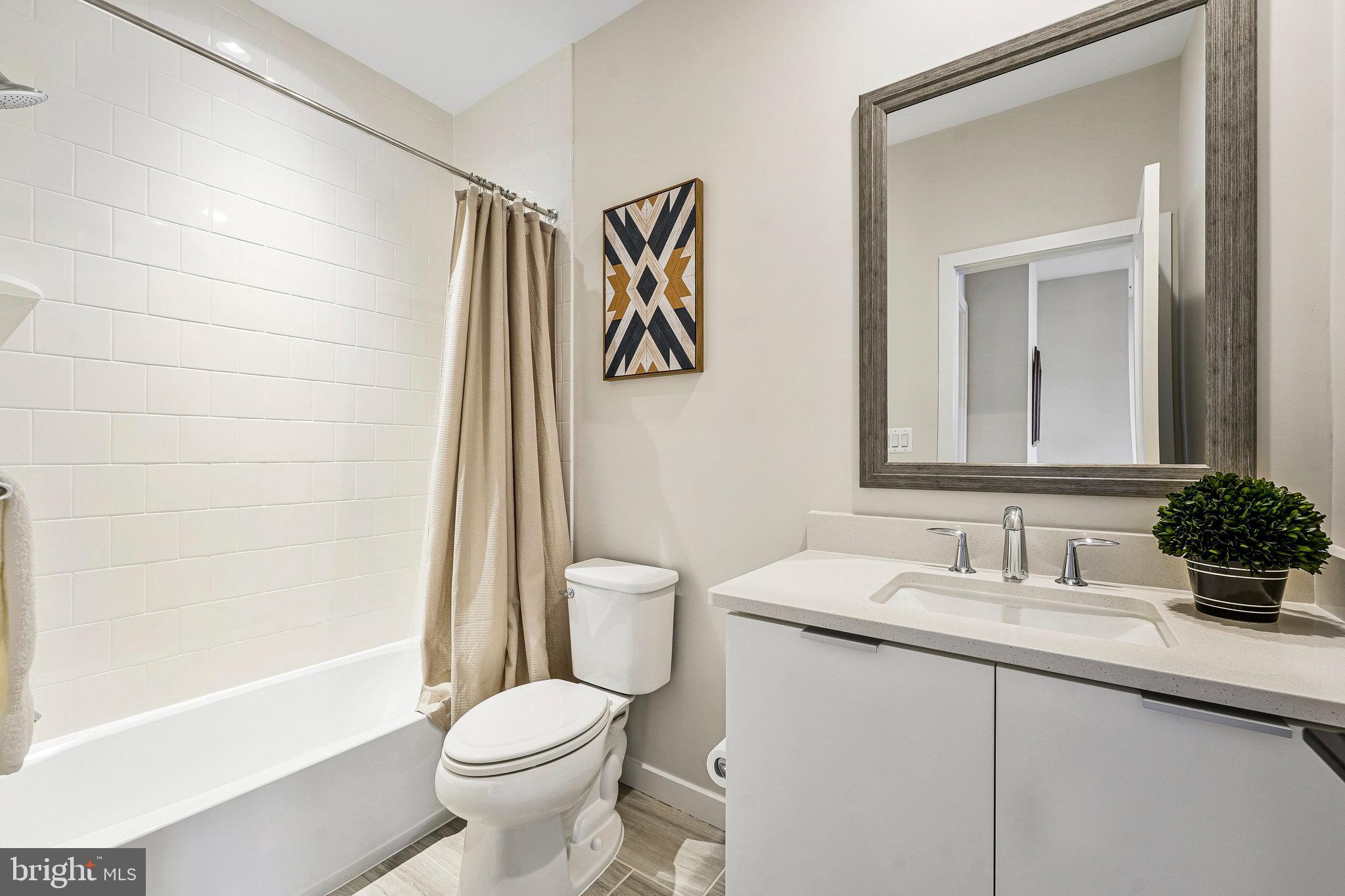 11716 Paysons Way Reston, VA 20191 - Photo 28 of 34 a bathroom with a sink toilet and shower